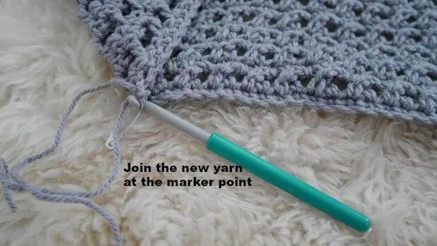 join the yarn at the maker point of the bottom front of the cardigan