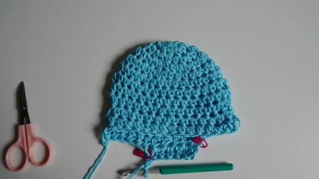 How to attach ear flaps to hat for any size.