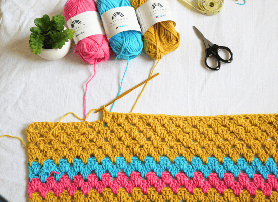 crochet colorful granny stripe in rows.